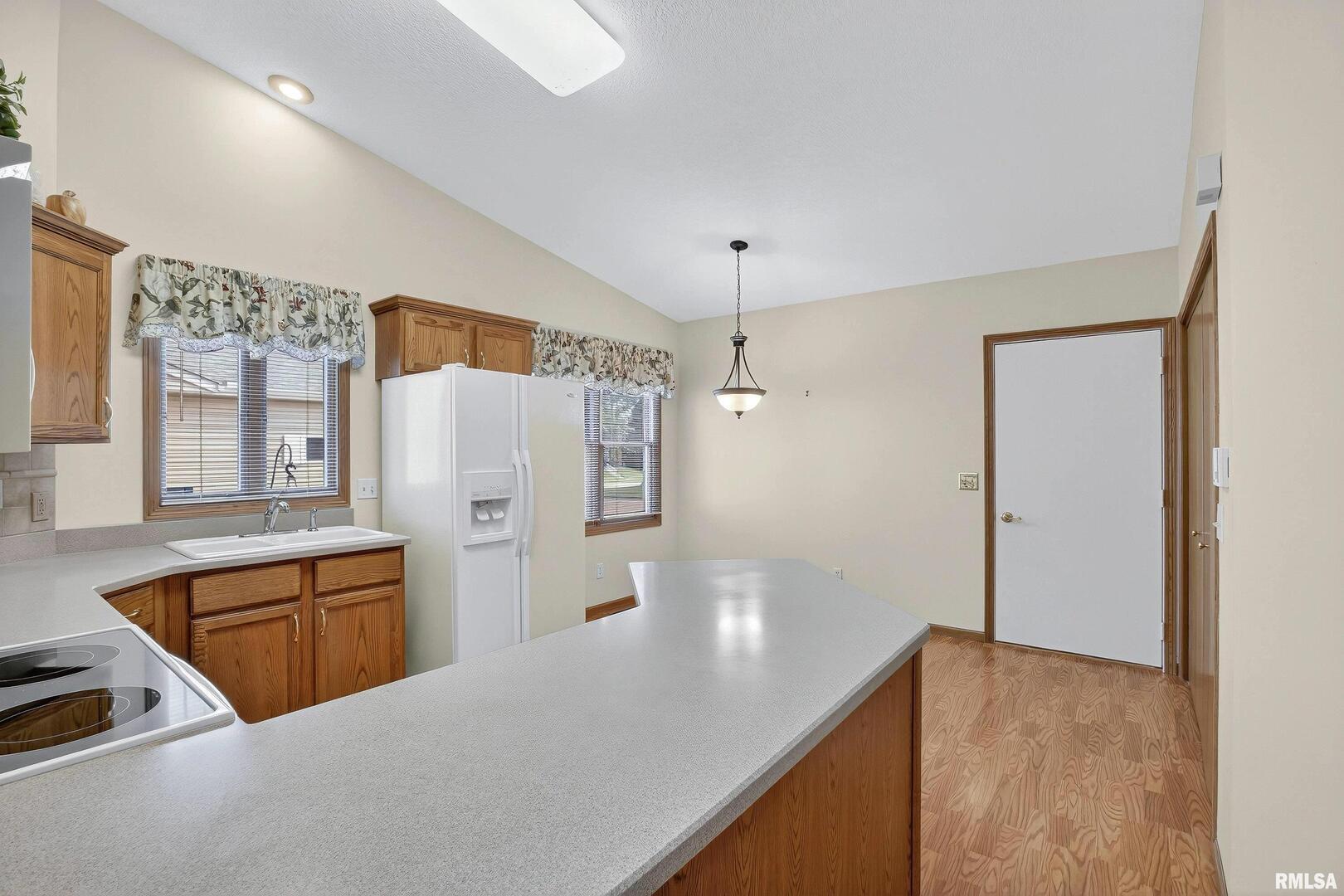 3988 Partridge Circle Bettendorf, IA 52722 - Photo 25 of 42 a kitchen with stainless steel appliances a refrigerator and a stove