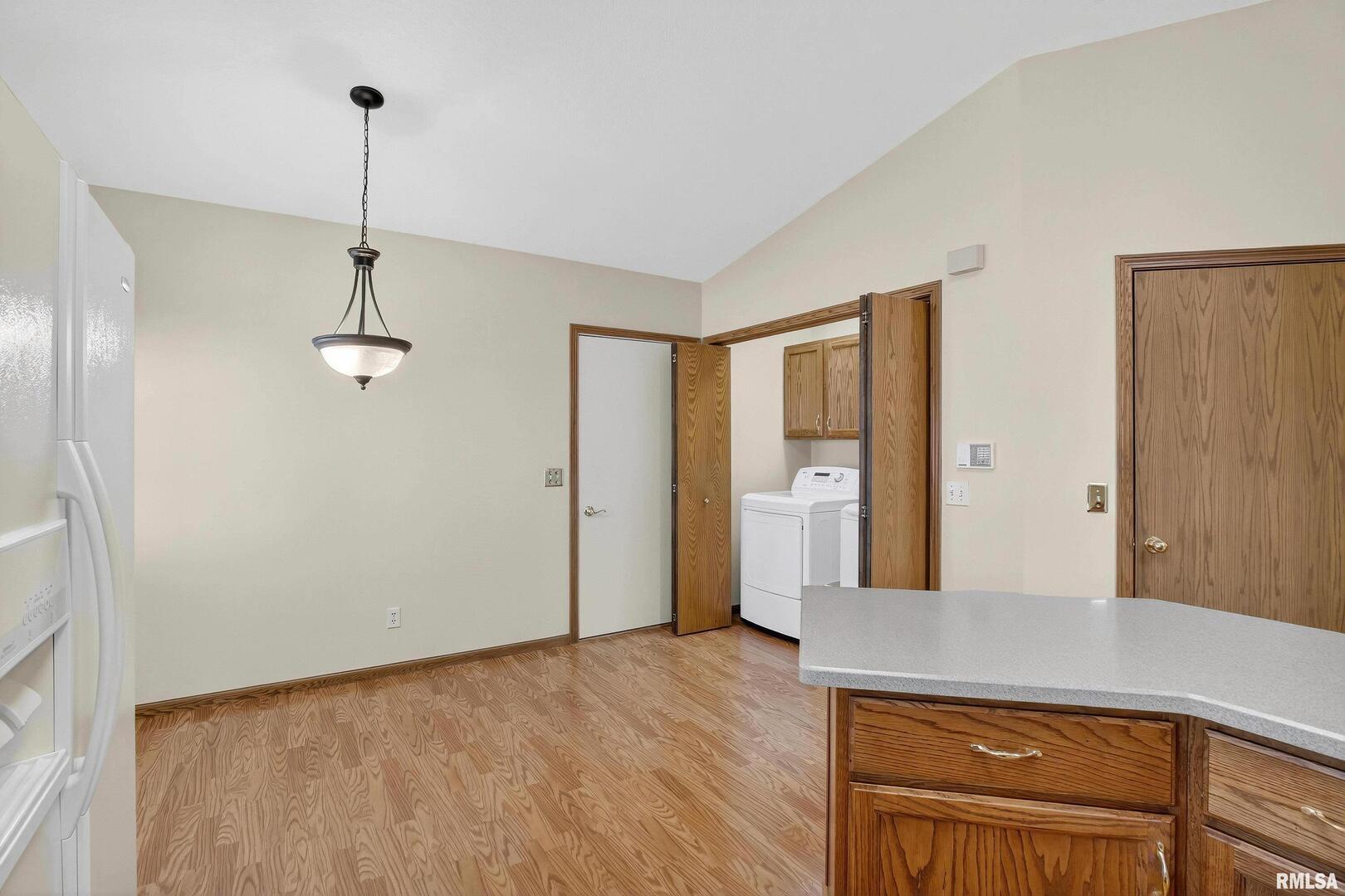 3988 Partridge Circle Bettendorf, IA 52722 - Photo 29 of 42 a view of a kitchen with a refrigerator a sink and dishwasher