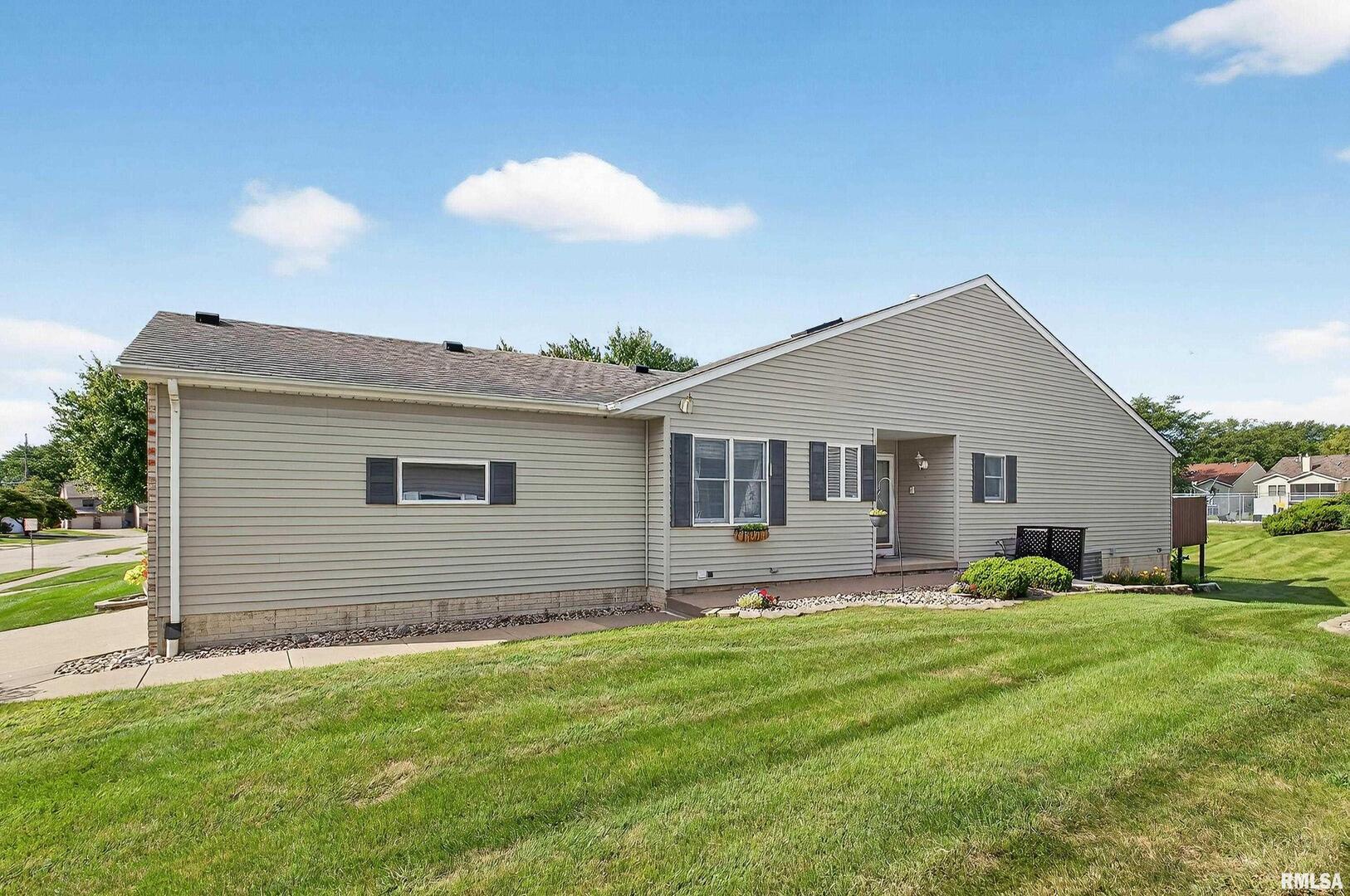 3988 Partridge Circle Bettendorf, IA 52722 - Photo 3 of 42 a house view with a sitting space and garden