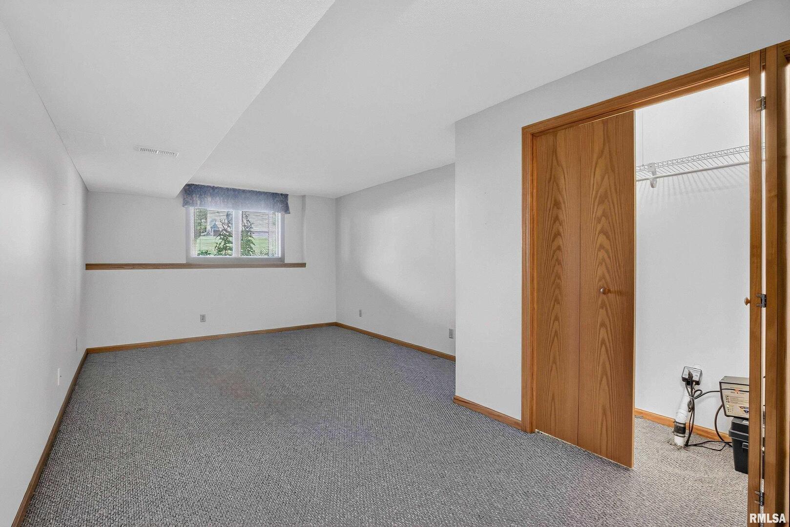 3988 Partridge Circle Bettendorf, IA 52722 - Photo 35 of 42 a view of an empty room with a window