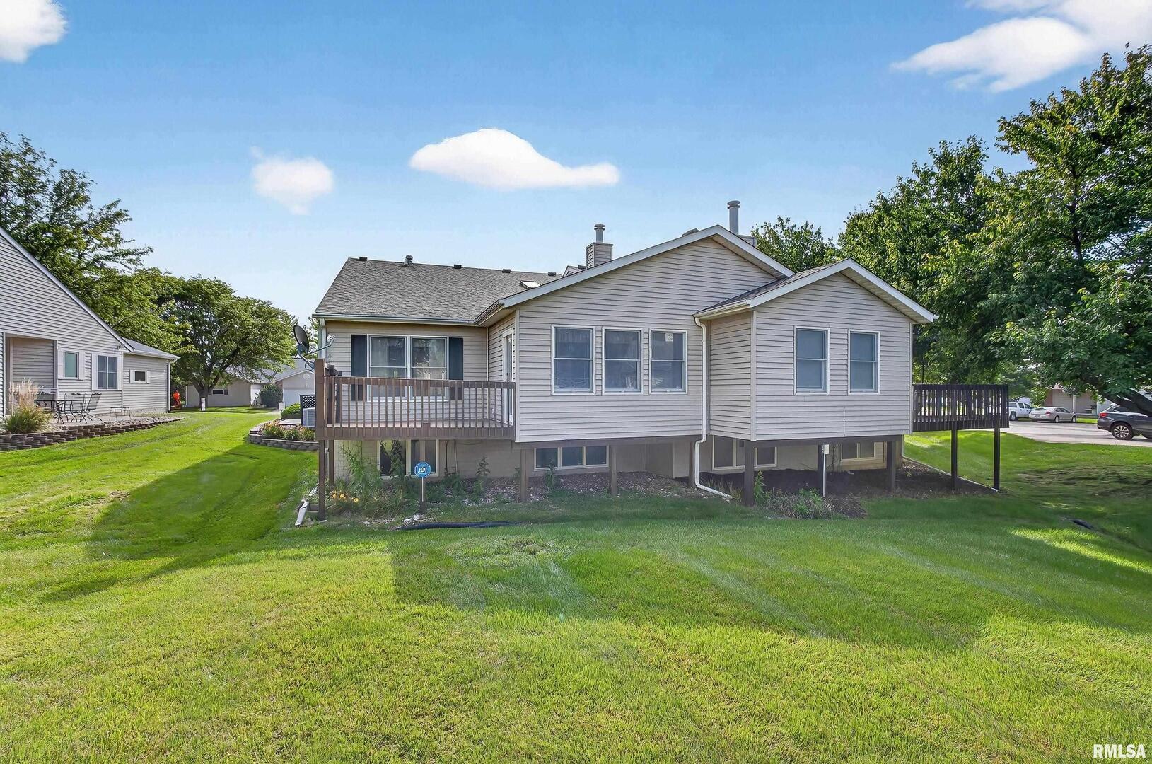 3988 Partridge Circle Bettendorf, IA 52722 - Photo 42 of 42 a view of a house with a yard and sitting area