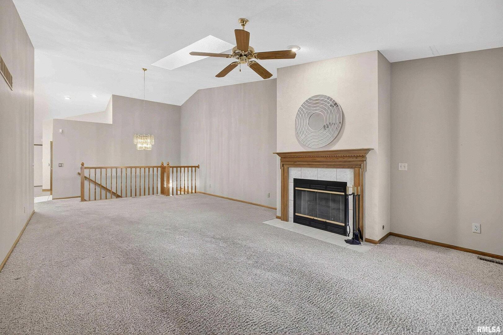3988 Partridge Circle Bettendorf, IA 52722 - Photo 10 of 42 a view of empty room with a fireplace