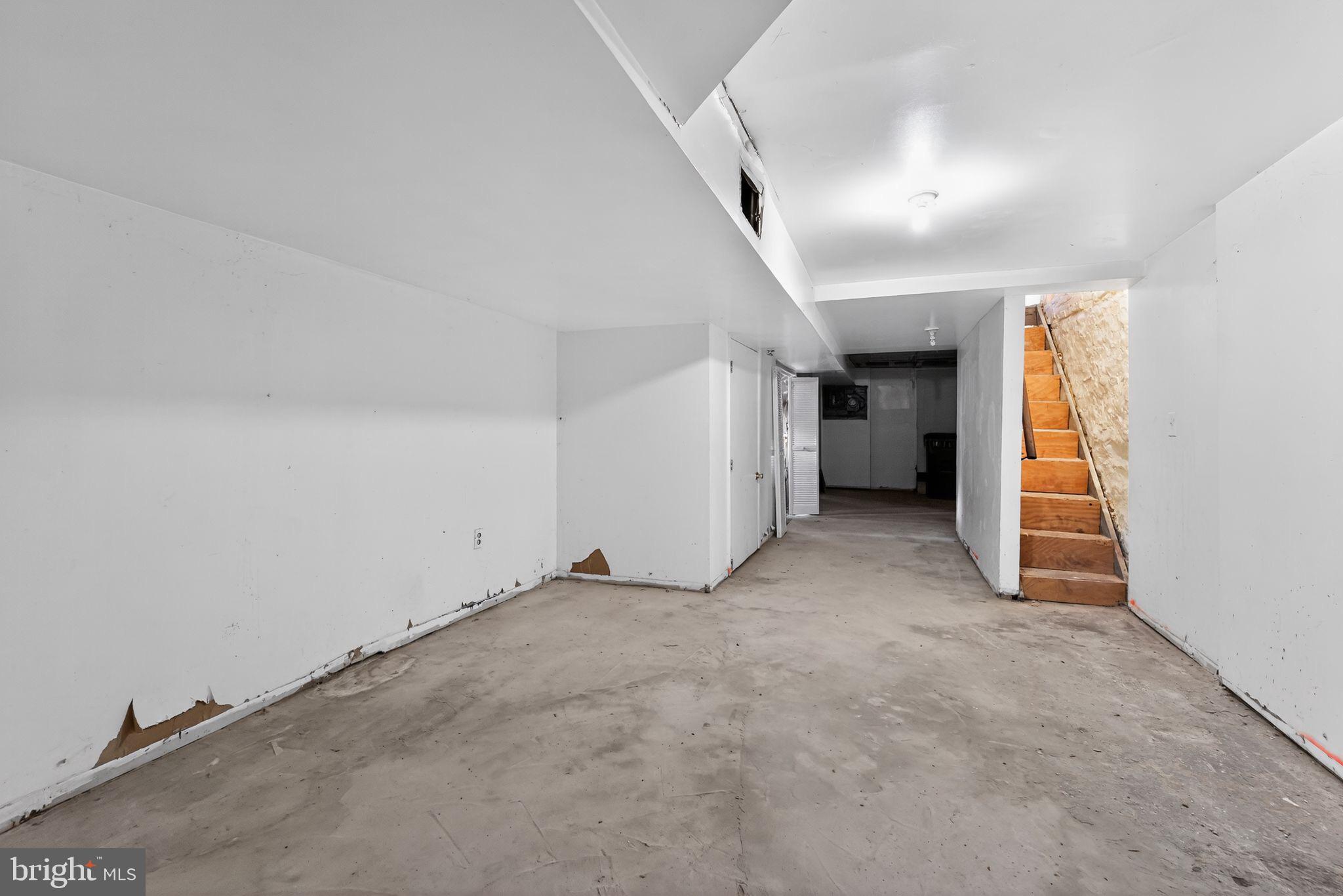 900 North Franklintown Road Baltimore, MD 21216 - Photo 16 of 16 an empty room with closet and stairs