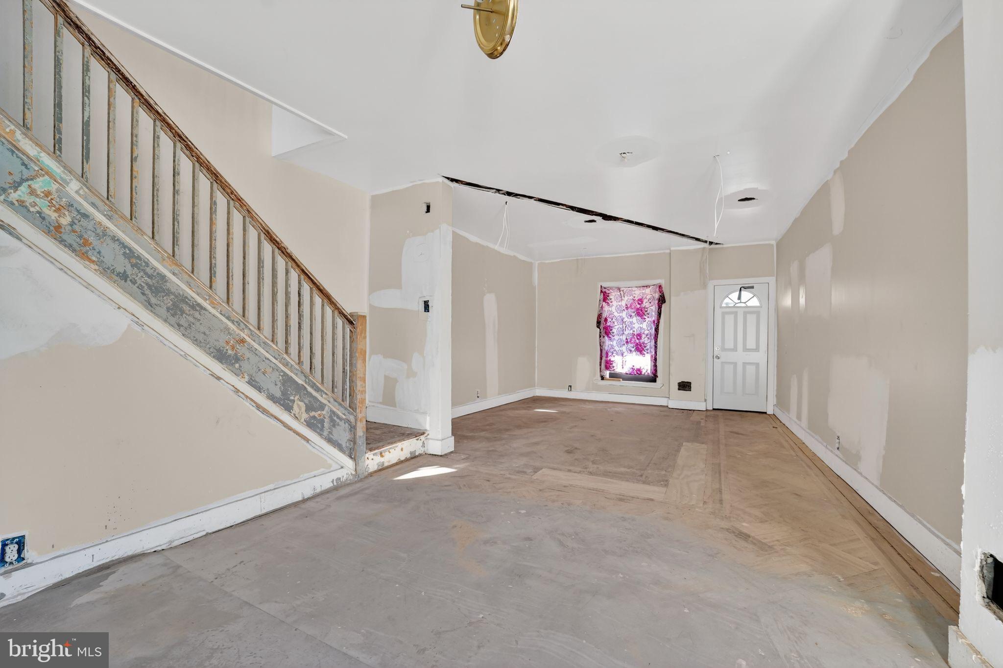 900 North Franklintown Road Baltimore, MD 21216 - Photo 6 of 16 a view of an empty room with stairs