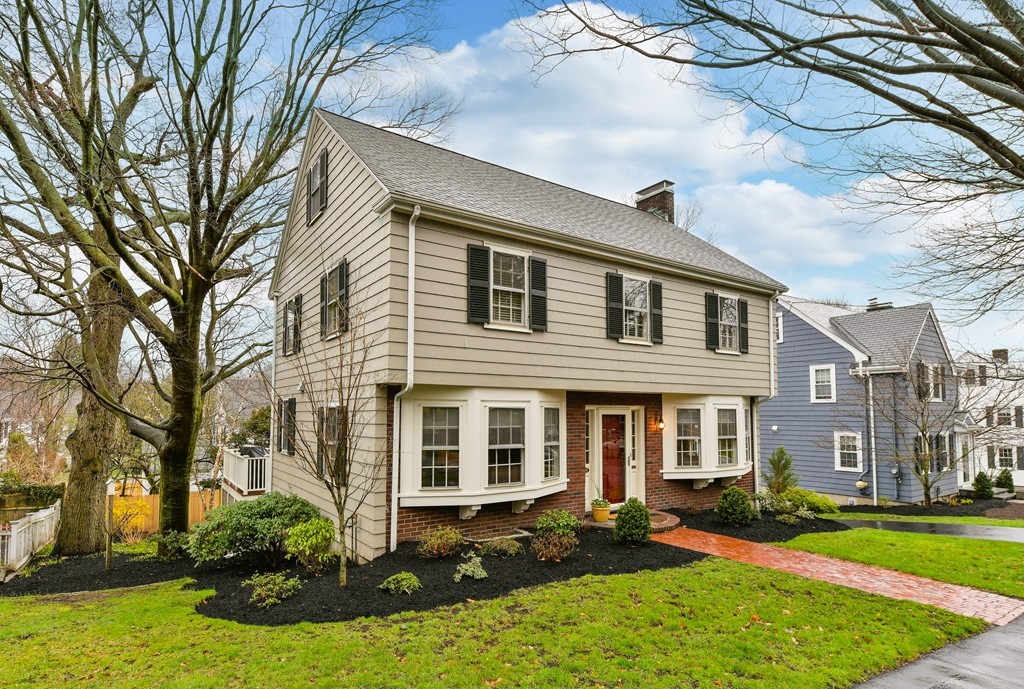 47 Standish Road Milton, MA 02186 - Photo 1 of 23 a front view of a house with a yard table and chairs