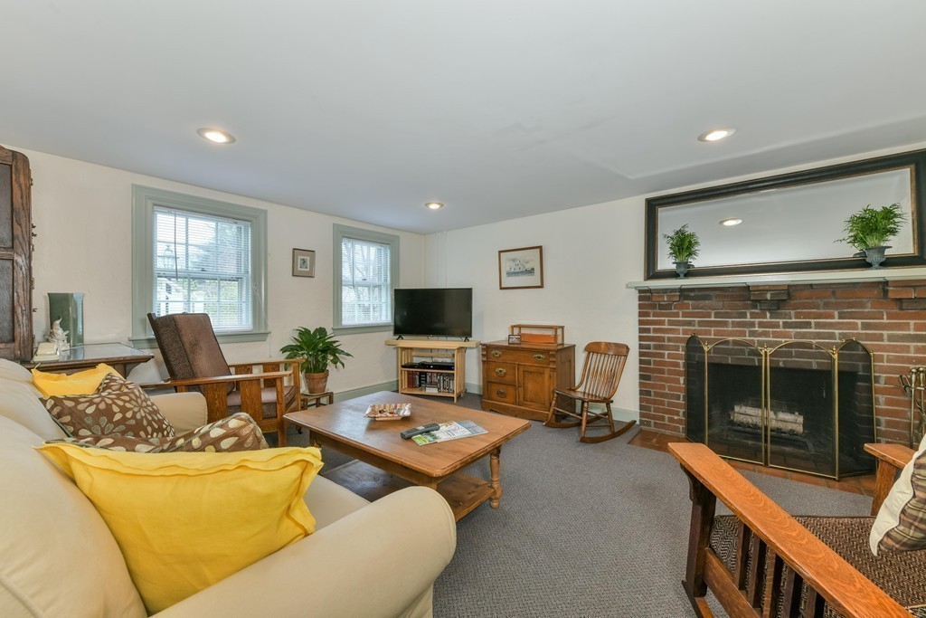 47 Standish Road Milton, MA 02186 - Photo 13 of 23 a living room with furniture and a fireplace