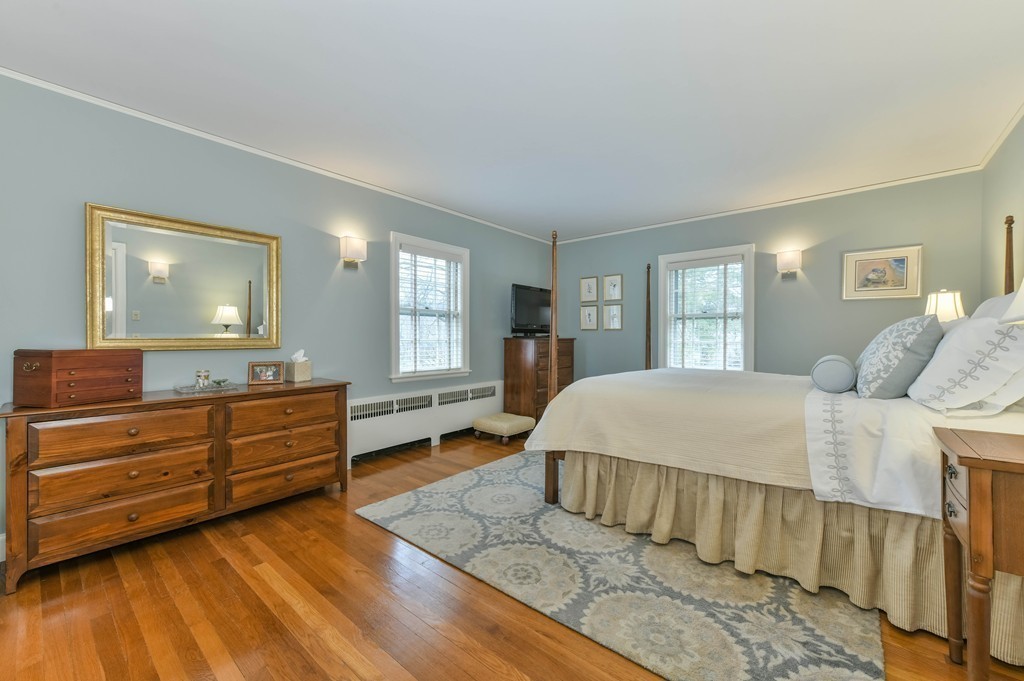 47 Standish Road Milton, MA 02186 - Photo 14 of 23 a bed room with a bed and a dresser