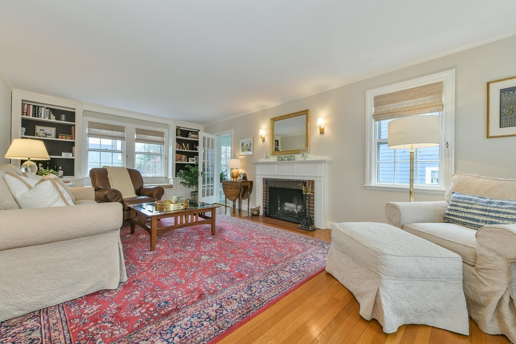 47 Standish Road Milton, MA 02186 - Photo 2 of 23 a living room with furniture and a fireplace