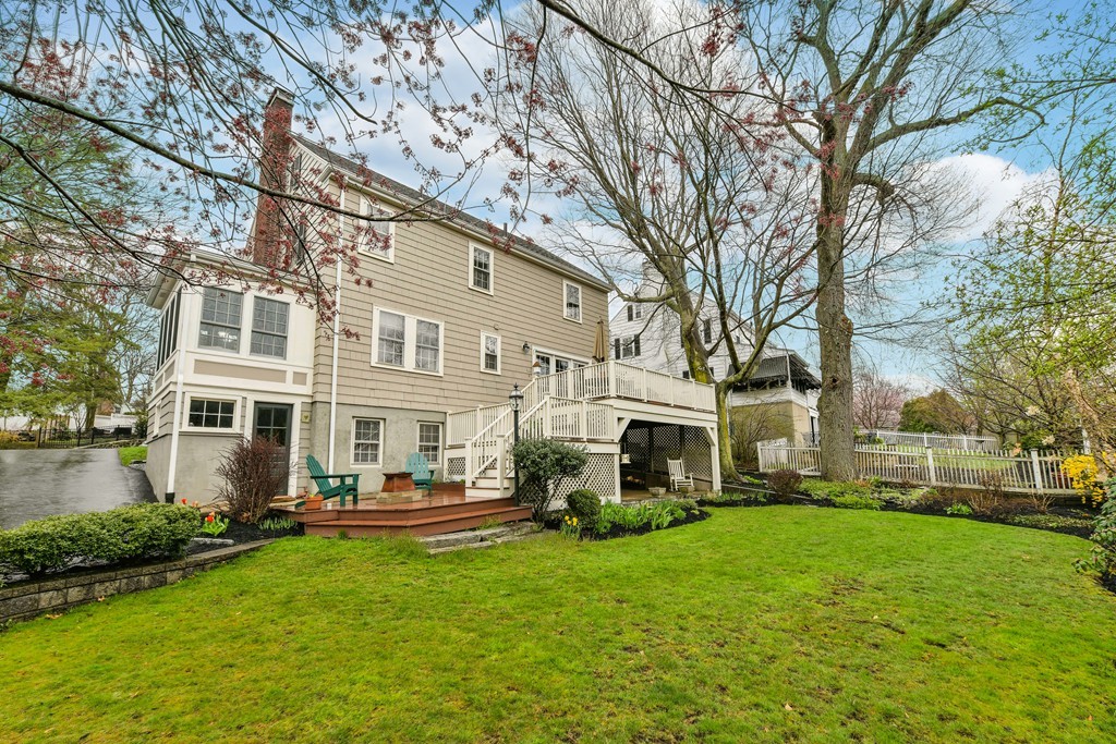 47 Standish Road Milton, MA 02186 - Photo 22 of 23 a front view of a building with a garden and trees