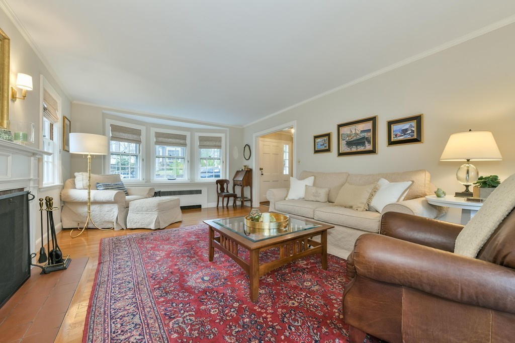 47 Standish Road Milton, MA 02186 - Photo 3 of 23 a living room with furniture a rug and a large window