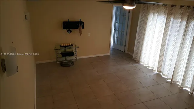 a view of a room with wooden door