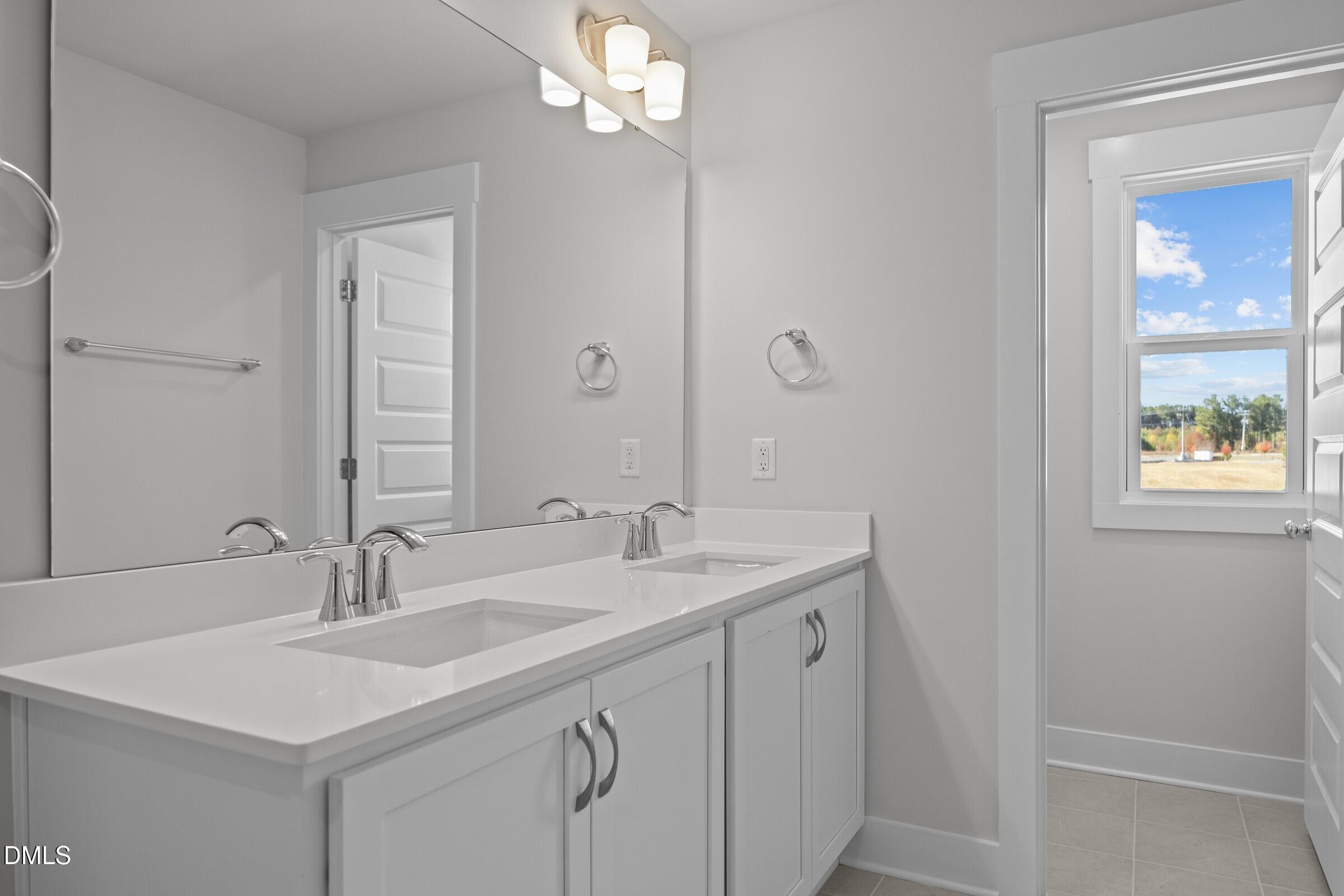 2916 Alyssa Court Raleigh, NC 27604 - Photo 15 of 21 Primary Bathroom - Classic White Button