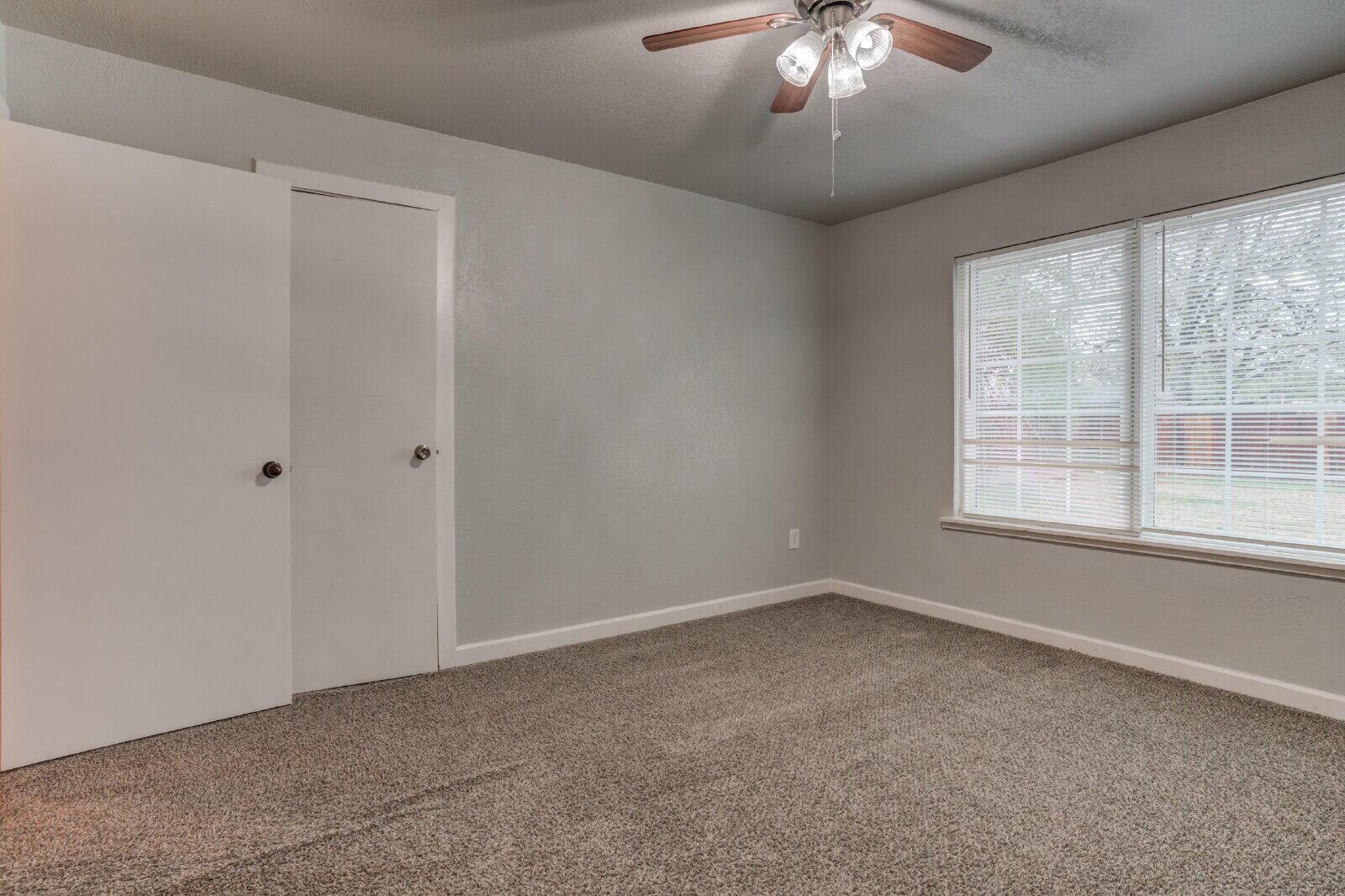 3415 27th Street Lubbock, TX 79410 - Photo 18 of 30 a view of an empty room with a window