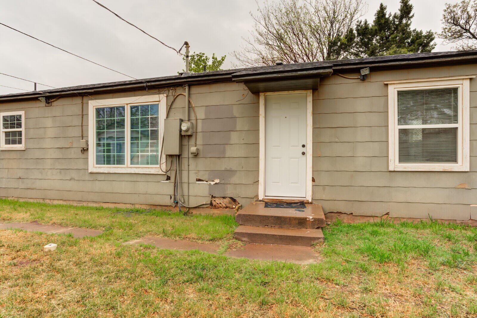 3415 27th Street Lubbock, TX 79410 - Photo 28 of 30 a front view of a house with a yard