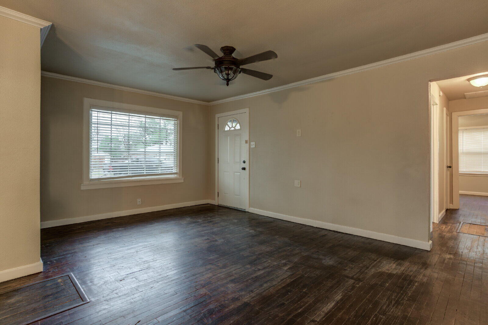 3415 27th Street Lubbock, TX 79410 - Photo 7 of 30 a view of an empty room window and wooden floor
