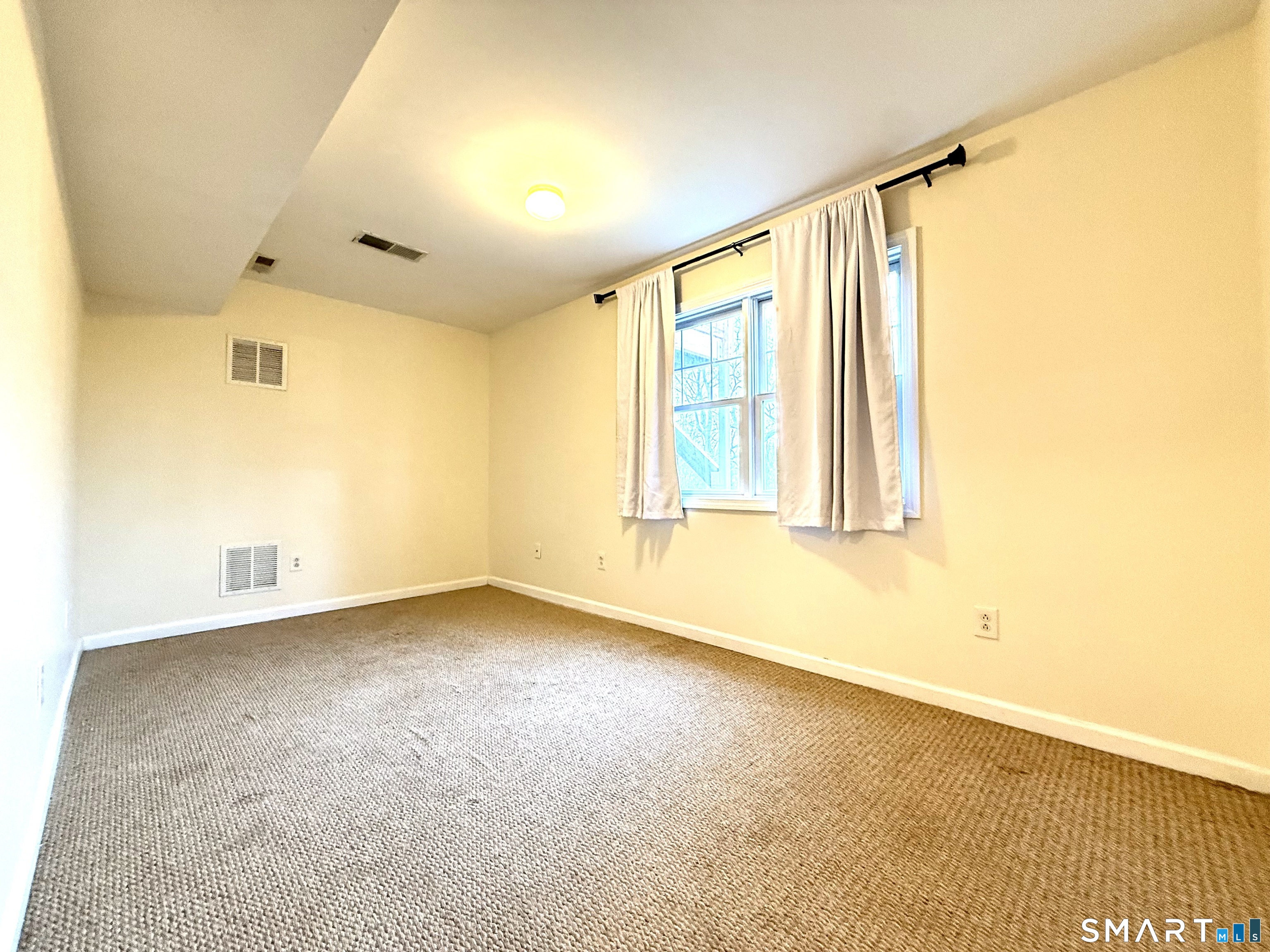 15 Scuppo Road, Unit 603 Danbury, CT 06811 - Photo 27 of 29 a view of an empty room with a window