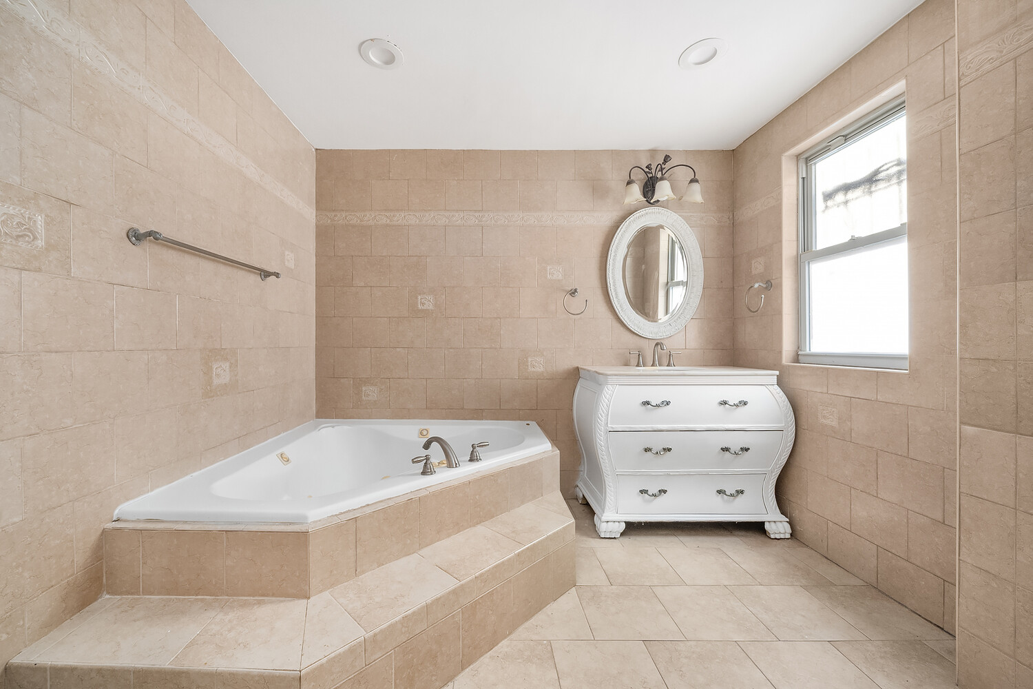 497 Decatur Street Brooklyn, NY 11233 - Photo 10 of 21 a bathroom with a bathtub sink and mirror