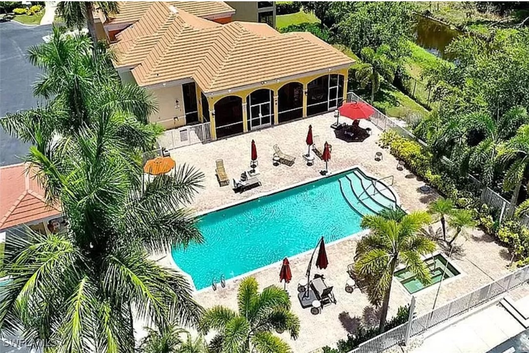 4450 Botanical Pl Circle, Unit 6 Naples, FL 34112 - Photo 2 of 33 an outdoor view with patio
