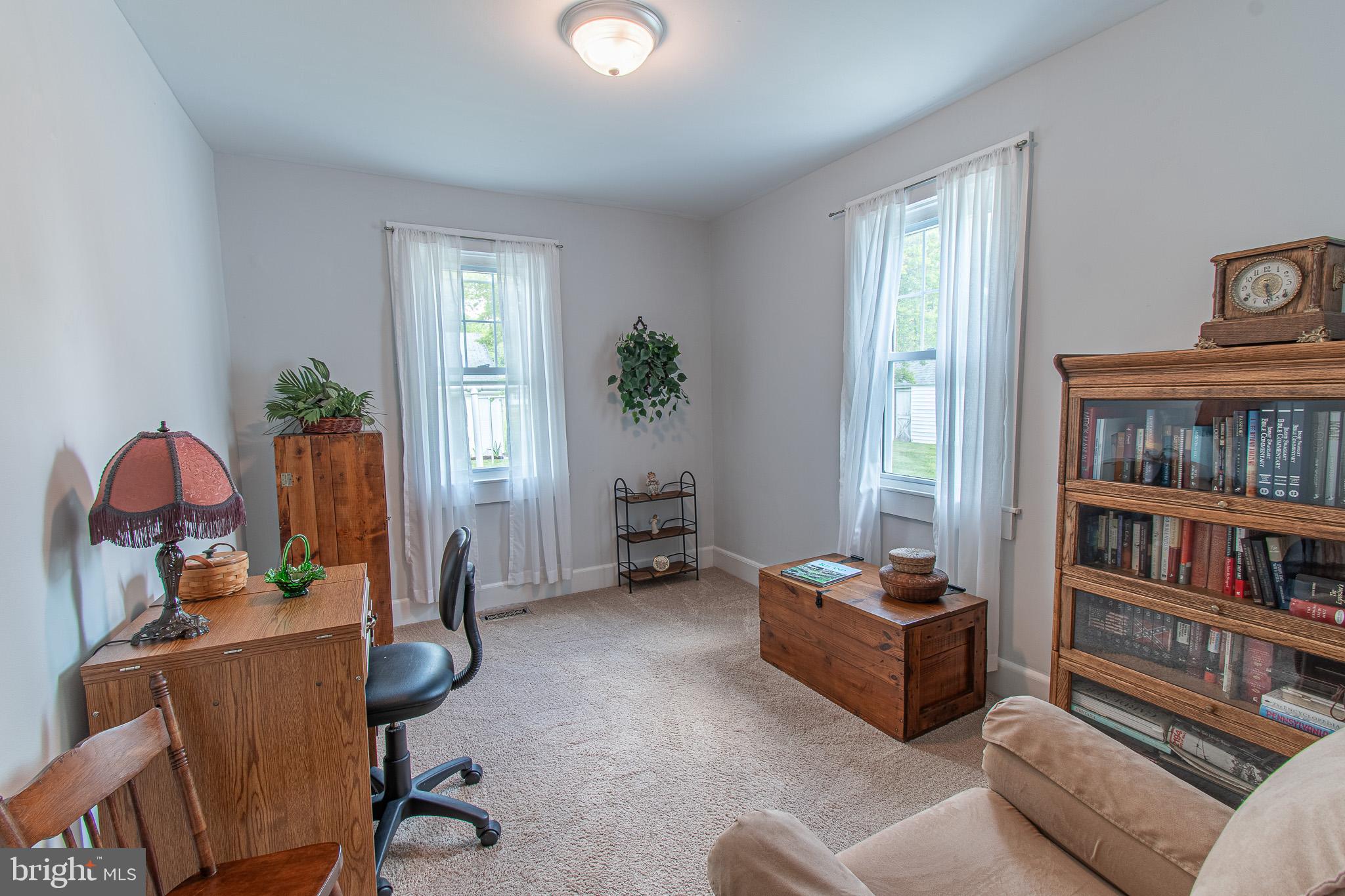 207 Crusader Road Cambridge, MD 21613 - Photo 33 of 76 a living room with furniture cabinets and a window