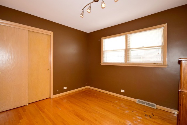 7301 West Roscoe Street Chicago, IL 60634 - Photo 12 of 22 an empty room with a window