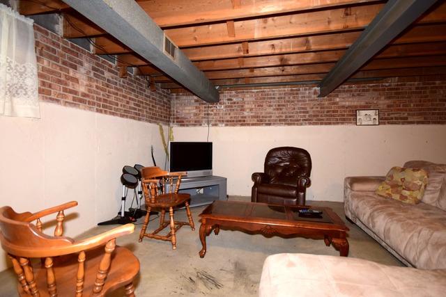 7301 West Roscoe Street Chicago, IL 60634 - Photo 18 of 22 a living room with furniture and a flat screen tv