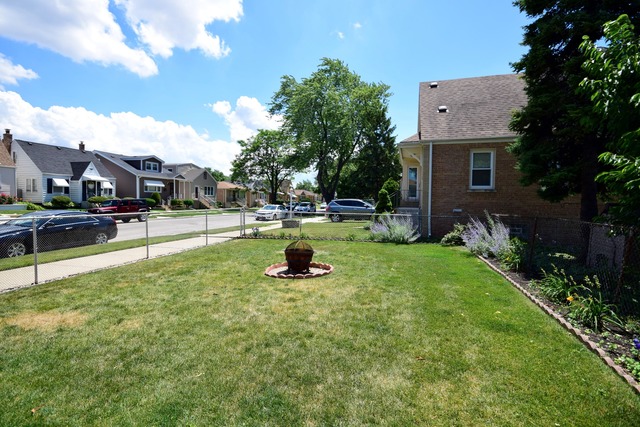 7301 West Roscoe Street Chicago, IL 60634 - Photo 22 of 22 a view of a backyard with sitting area