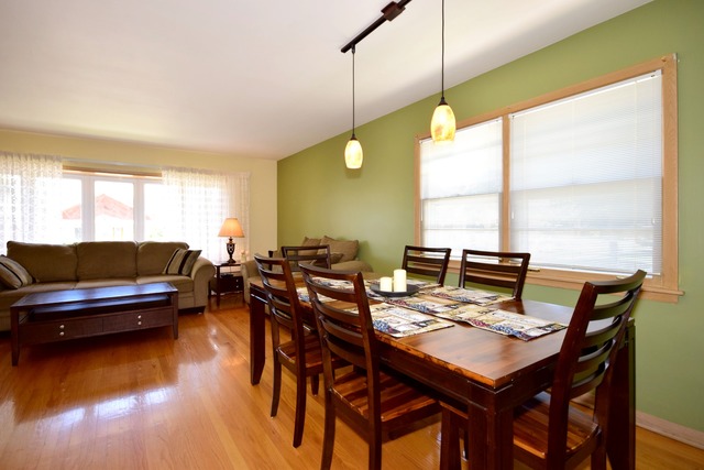 7301 West Roscoe Street Chicago, IL 60634 - Photo 6 of 22 a view of a dining room with furniture and window