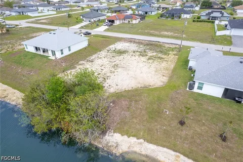 an aerial view of a house with a swimming pool