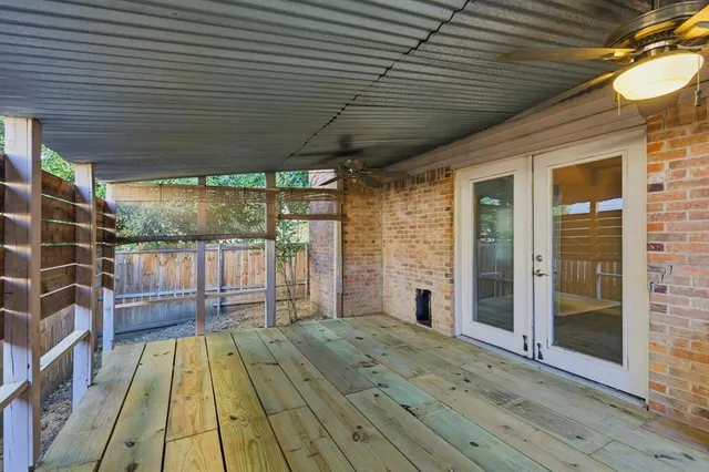 a view of balcony with wooden floor