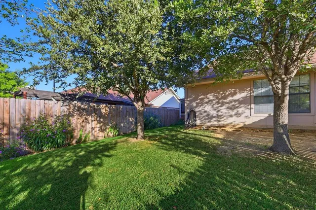 a backyard of a house with lots of green space