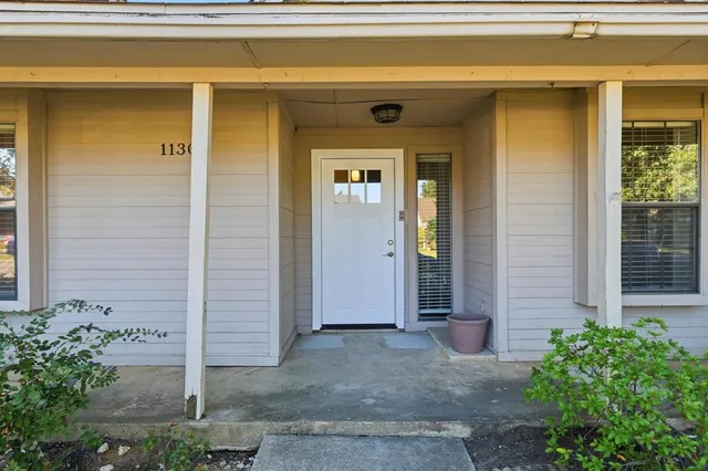 a front view of a house with a porch
