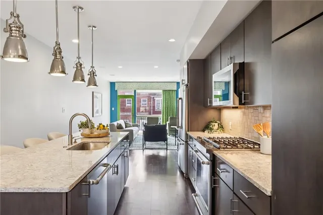 a kitchen with a stove and a sink