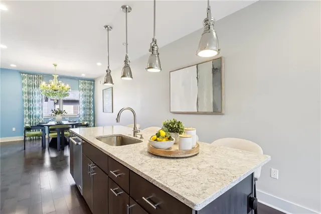 a kitchen with sink cabinets and wooden floor