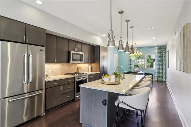 a kitchen with a dining table and chairs