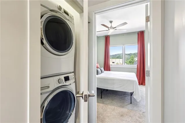 a view of a hallway with washer and dryer