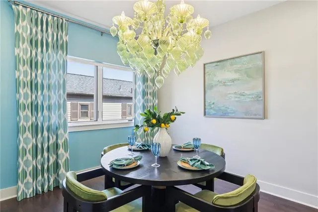 a dining room with furniture and chandelier