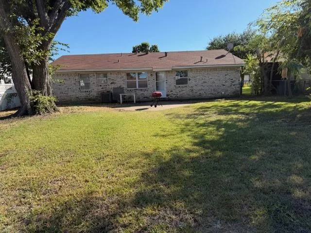a view of a large house with a large pool