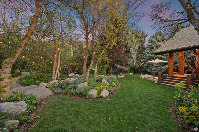 10280 Dimple Dell Road Sandy, UT 84092 - Photo 26 of 58 Yard at dusk with a lawn and view of scattered trees