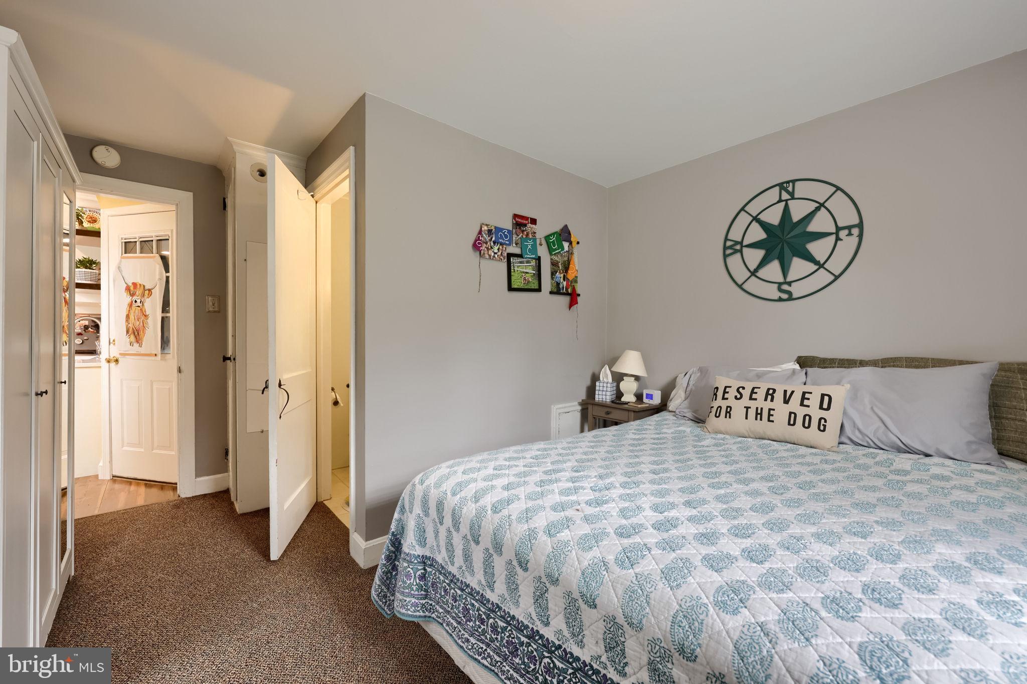 9 Haskell Drive Lancaster, PA 17601 - Photo 19 of 32 a bedroom with a large bed and a chandelier