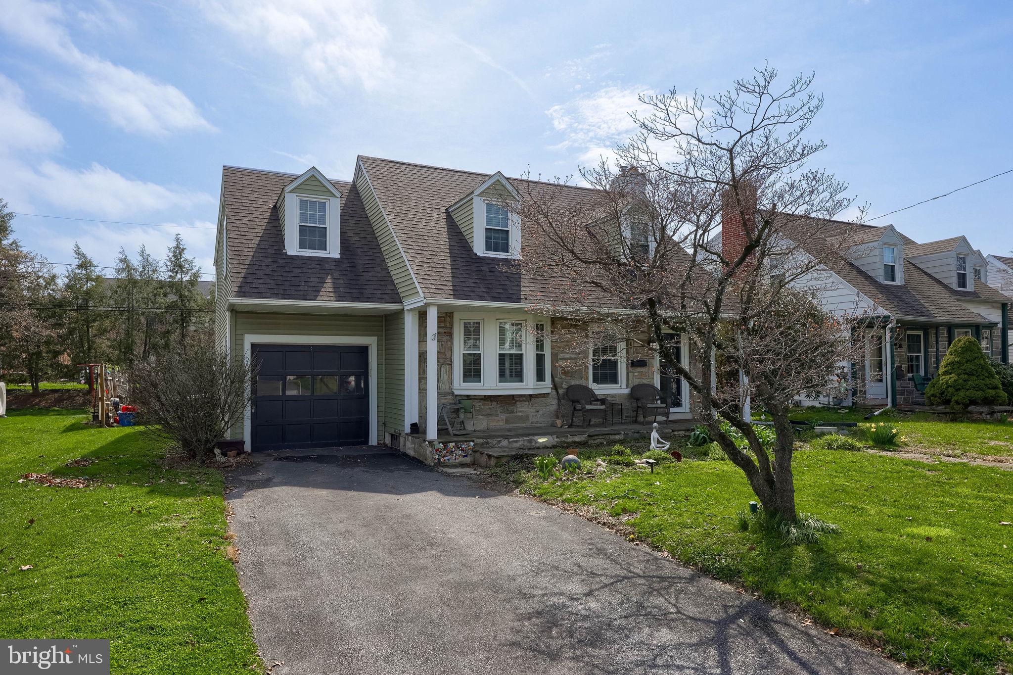9 Haskell Drive Lancaster, PA 17601 - Photo 2 of 32 a view of a brick house with a yard and large tree