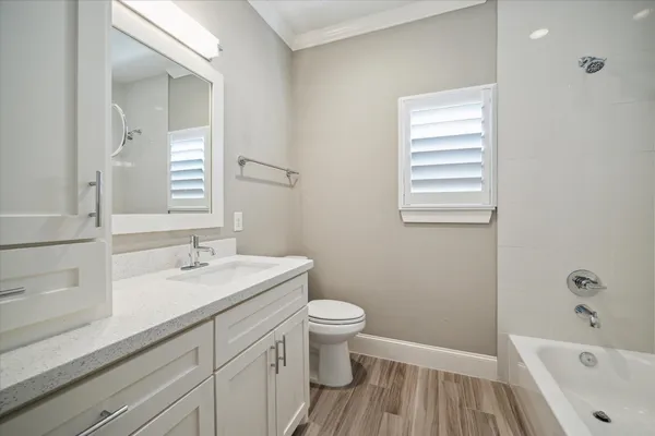 a bathroom with a sink a toilet and a bathtub
