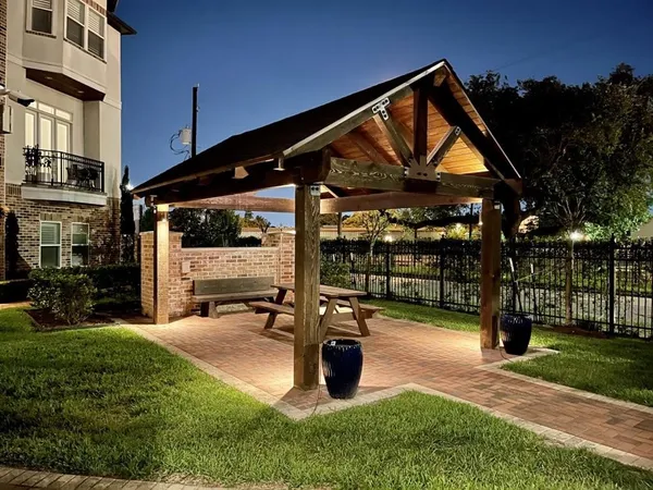 a view of a house with backyard and porch