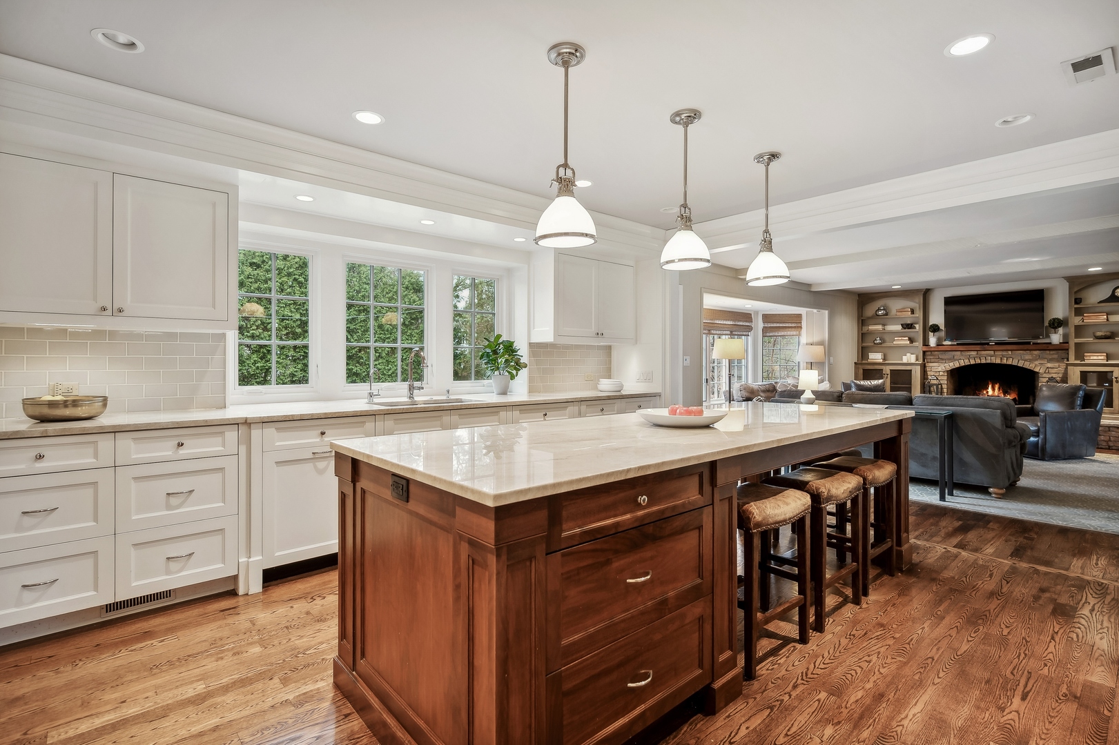 2002 Brandon Road Glenview, IL 60025 - Photo 12 of 37 a kitchen with kitchen island granite countertop a sink a counter space appliances and cabinets