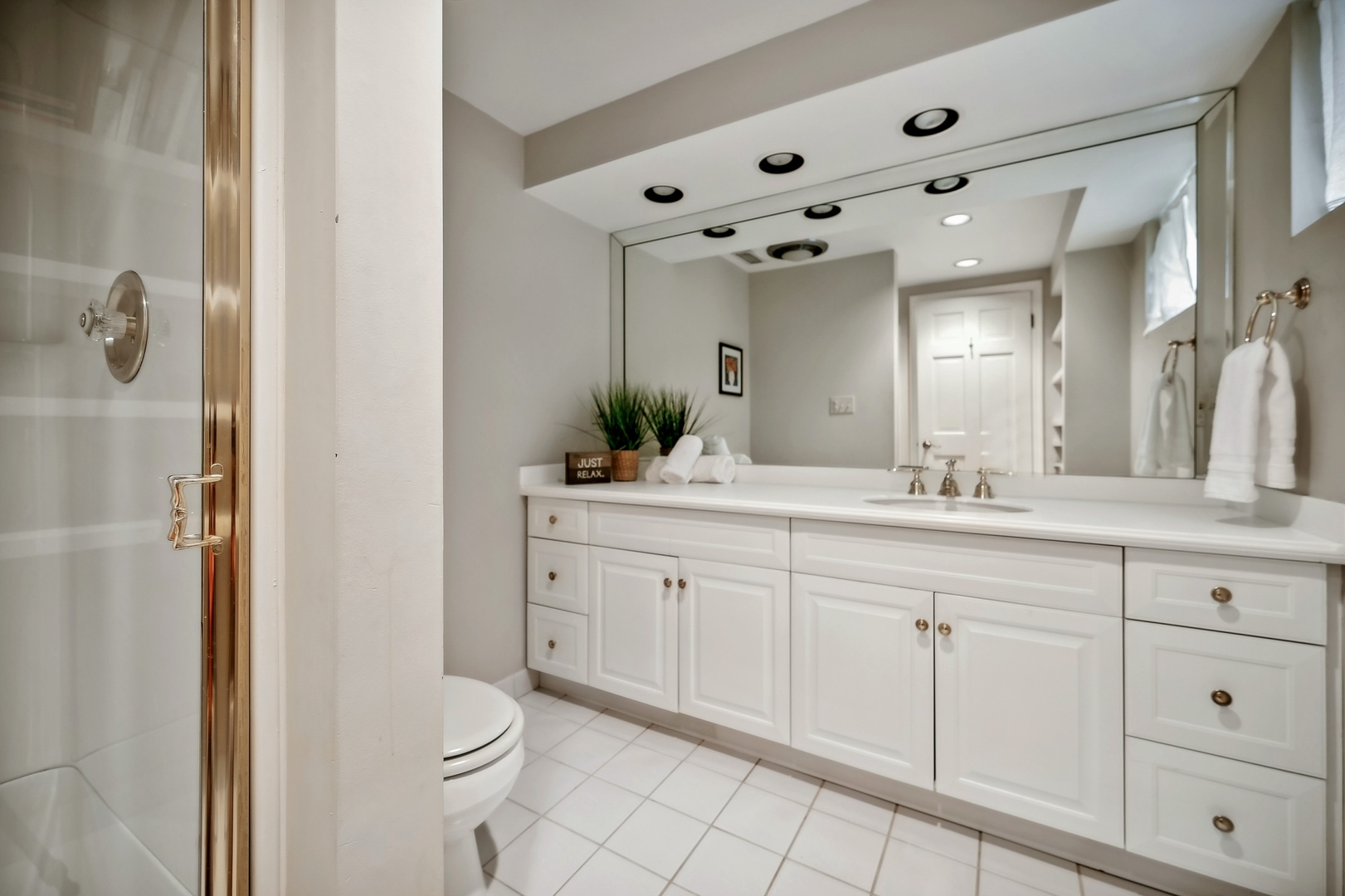 2002 Brandon Road Glenview, IL 60025 - Photo 28 of 37 a spacious bathroom with a double vanity sink mirror and toilet