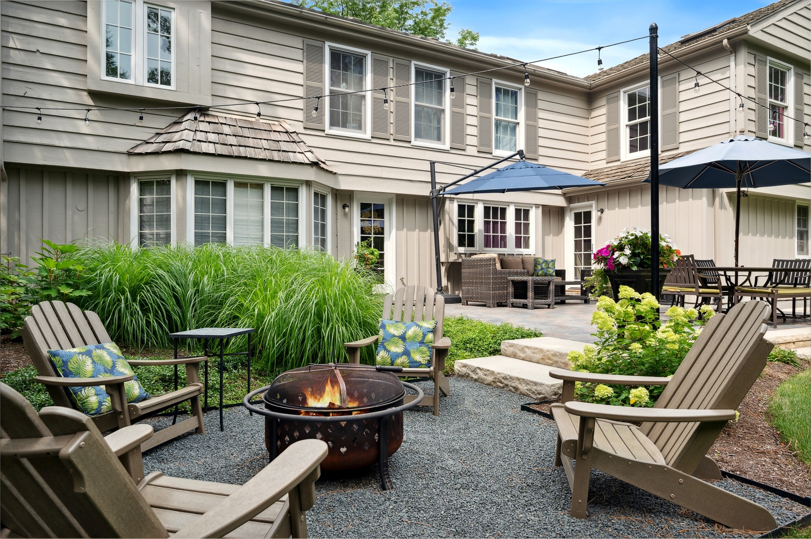 2002 Brandon Road Glenview, IL 60025 - Photo 29 of 37 a backyard of a house with yard fire pit and outdoor seating