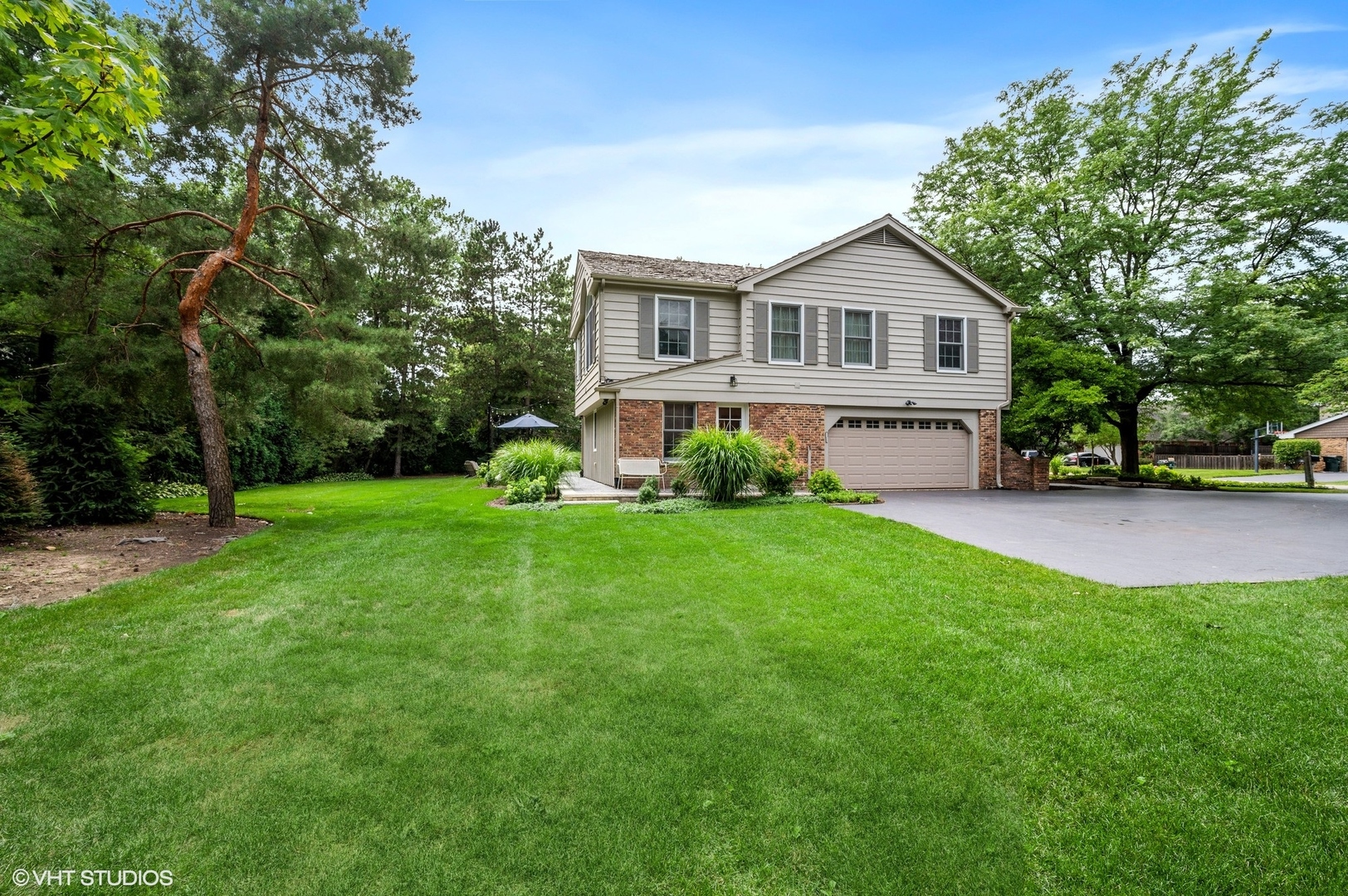 2002 Brandon Road Glenview, IL 60025 - Photo 33 of 37 a front view of a house with garden