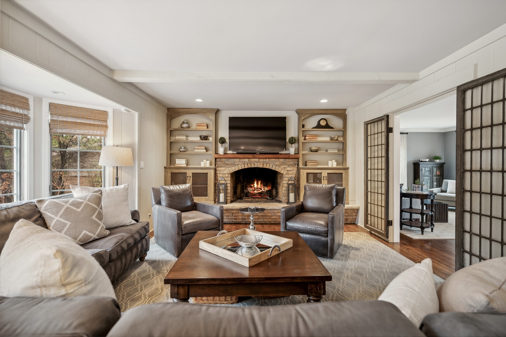2002 Brandon Road Glenview, IL 60025 - Photo 6 of 37 a living room with furniture large window and a fireplace