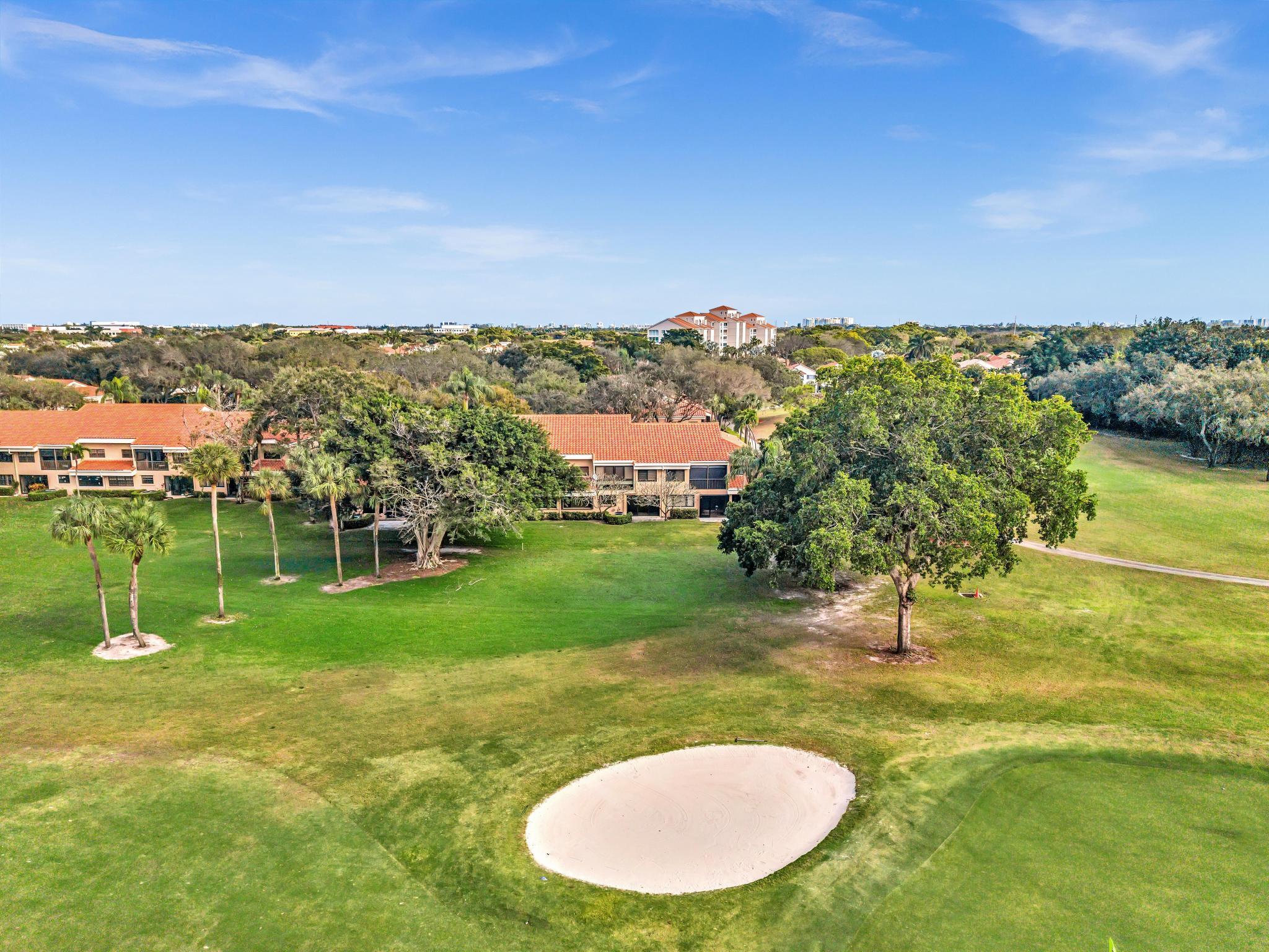 17372 Boca Club Boulevard, Unit 405 Boca Raton, FL 33487 - Photo 58 of 74 a view of a lake with a houses