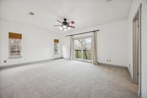 an entryway of a house with wooden floor