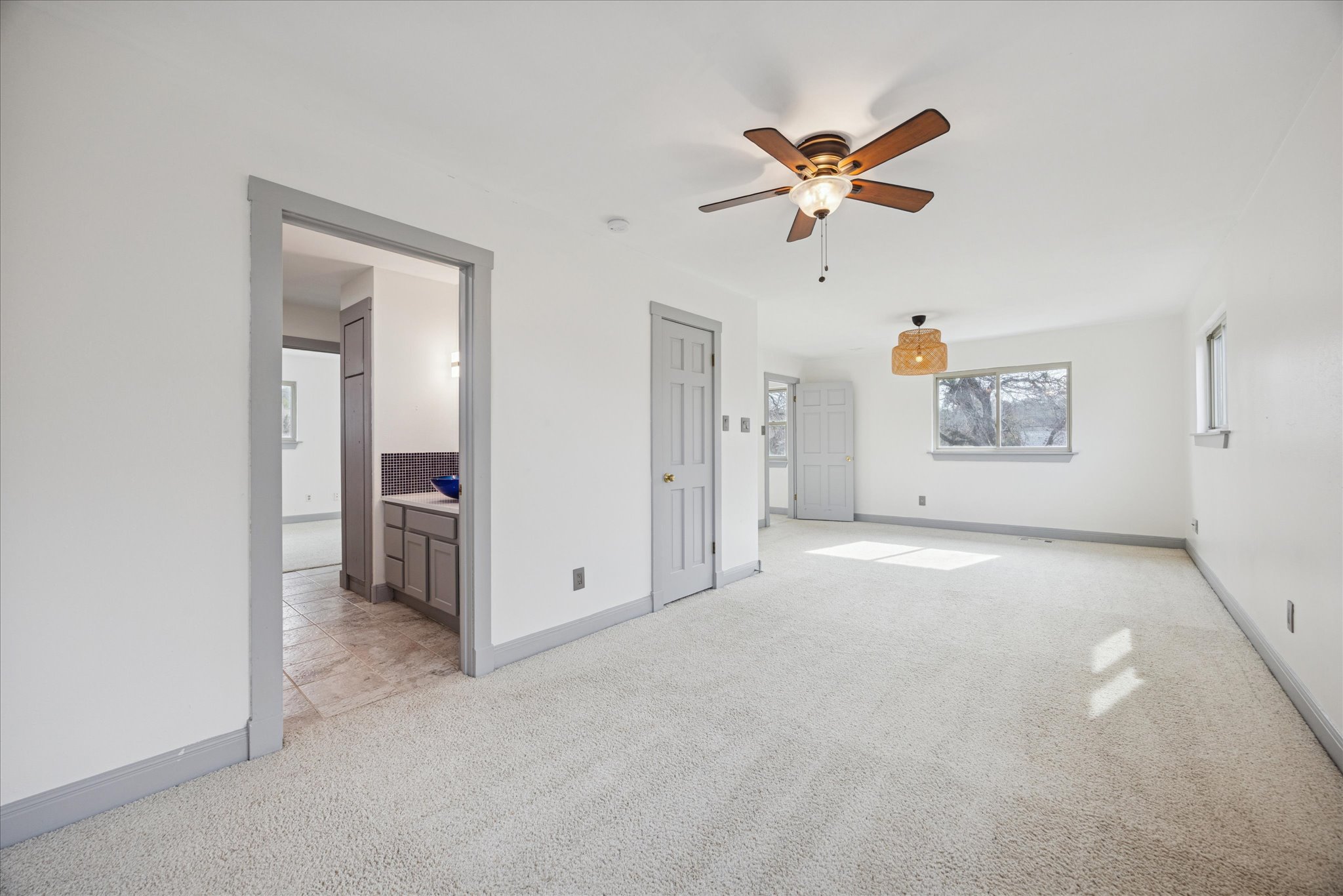 13918 Hummingbird Lane Austin, TX 78732 - Photo 17 of 32 a view of a livingroom with a ceiling fan and window